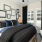 furnished bedroom with ceiling fan and light fixture